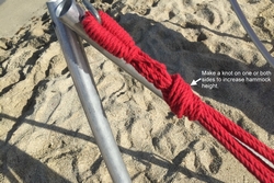 Make knot on hammock fabric loop to make it shorter