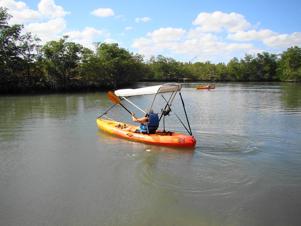 Bimini top for sit on top kayak with fishing rod holders attached to 