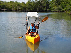 Bimini top for sit on top kayak with fishing rod holders attached to sun shade support poles. Click on image to enlarge.
