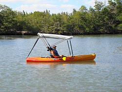 Bimini top for sit on top kayak with fishing rod holders attached to 