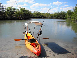 Bimini top for sit on top kayak with fishing rod holders attached to sun shade support poles. Click on image to enlarge.