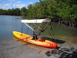 Bimini top for sit on top kayak with fishing rod holders attached to sun shade support poles. Click on image to enlarge.