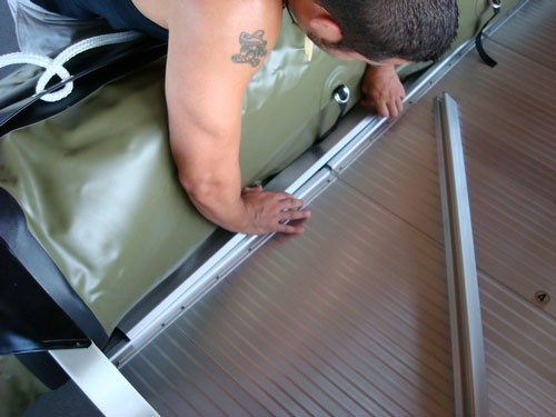 Insert aluminum stringers between boat tubes and floor sections.