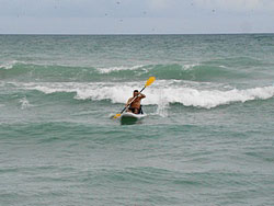 Surfing waves with Saturn SOT330 sit on top inflatable surf kayak. Click to zoom in.