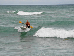 Surfing waves with Saturn SOT330 sit on top inflatable surf kayak. Click to zoom in.