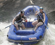 inflatable white water river raft in action. Category 4 rivers rubber rafts and sport whitewater rafts.