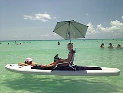 Turn heads on a beach by attaching low profile beach chair and Sport-Brella umbrella to Saturn SUP.
