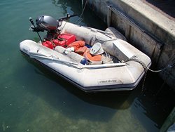 PVC boat left in a marine unprotected under the Sun.