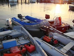 Inflatable Boat protected from Sun with tube covers.