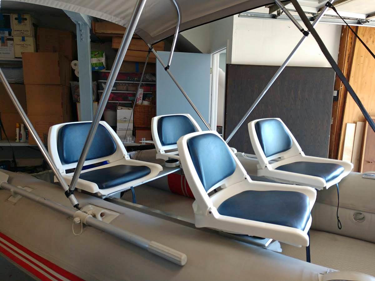 Fishing chair on aluminum bench of inflatable boat