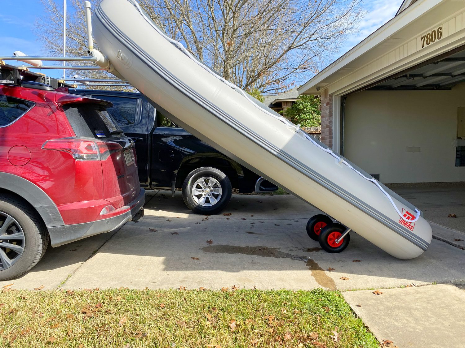 Mars Inflatable Boat being loaded on top of small car