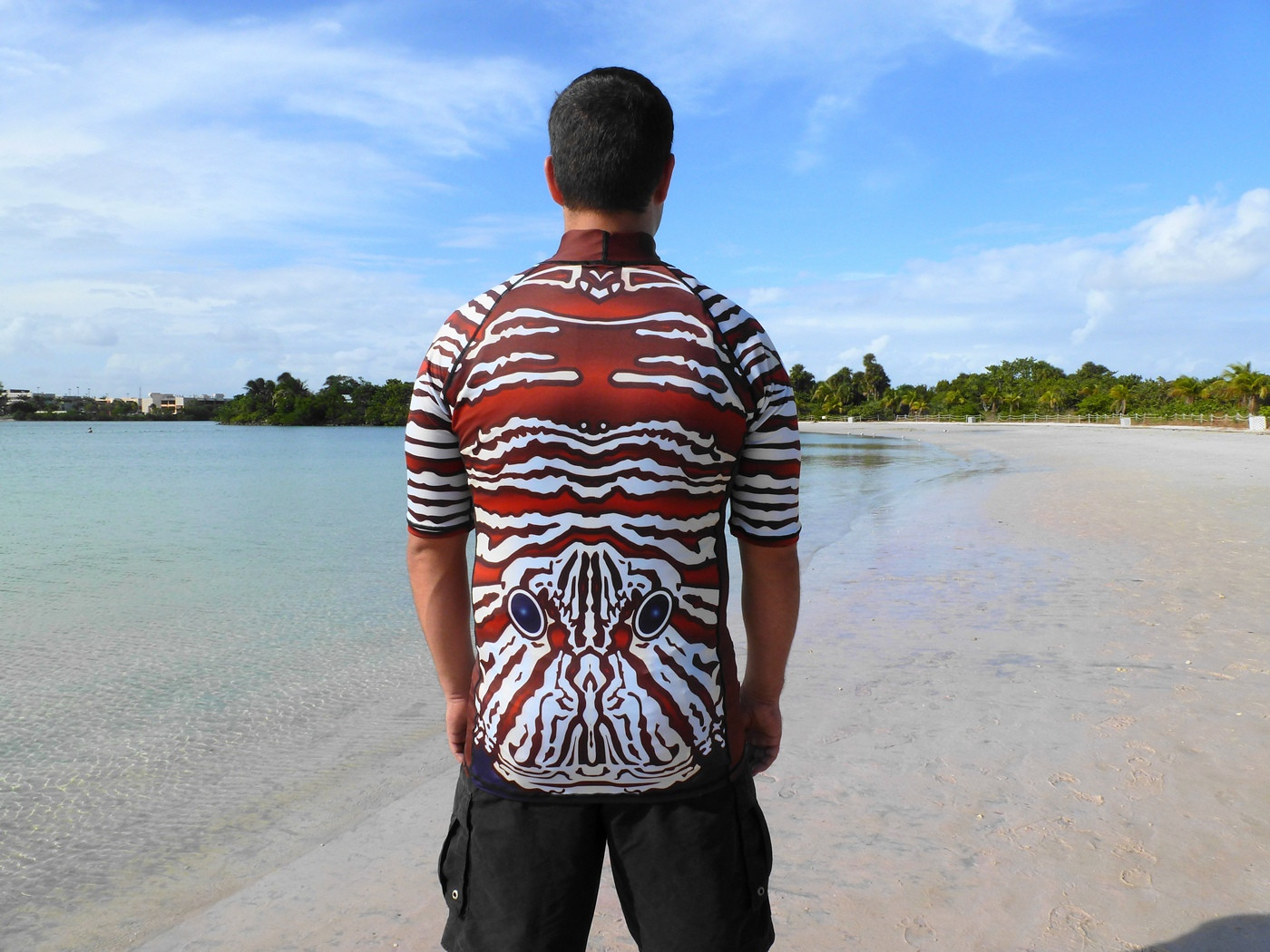 shark repellent rash guard for beach and water sports.