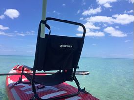 Beach umbrella installed on chair