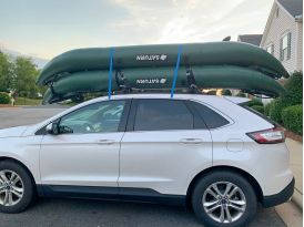 2 Kayaks loaded on top of car