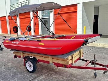 Red MC365 Cat on trailer