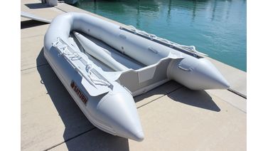 Inflatable boat in marina without floor