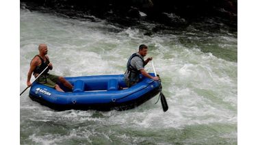 Rafting in river raft with dad