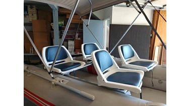 Fishing chair on aluminum bench of inflatable boat
