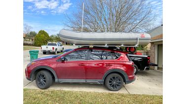 Inflatable Boat loaded on top of car