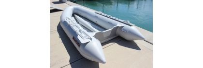 Inflatable boat in marina without floor