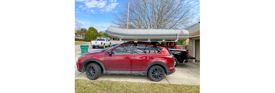 Inflatable Boat loaded on top of car